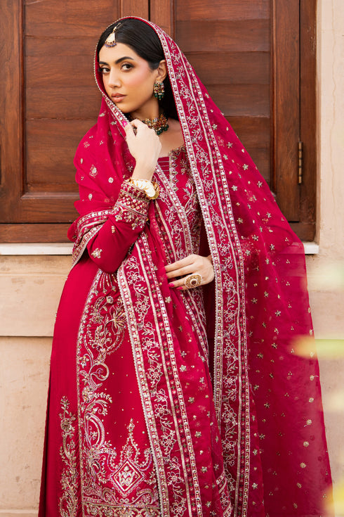 NAQSHI Gul-e-Zeenat side angle – model carrying red embroidered dupatta with fine borders and sequin spray